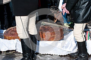 Mens in traditional clothes, double bass on the background