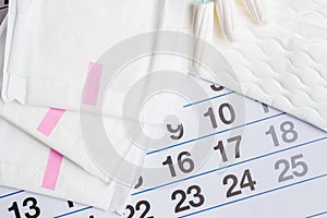 Menstrual calendar with tampons and pads. Menstruation time. Hygiene and protection