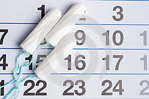Menstrual calendar with tampons and pads. Menstruation time. Hygiene and protection