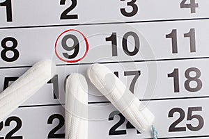 Menstrual calendar with tampons and pads. Menstruation time. Hygiene and protection