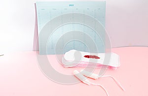 Menstrual pad with schedule card background