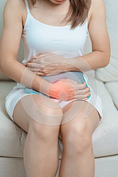 Menstruation period cycle of monthly and Stomachache concepts. woman having abdomen pain and menstrual ache with hot water bottle