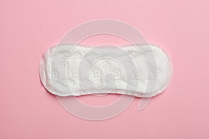 Menstruation, sanitary pad on pink