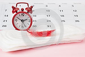 Menstruation Sanitary pad for woman menstrual period. Clocks and calendar