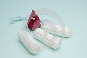 Menstruation sanitary soft cotton tampon for woman hygiene protection and crochet funny blood drop. Woman critical days, gynecolog