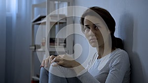 Mental disease patient sitting on floor, hospital therapy, schizophrenia