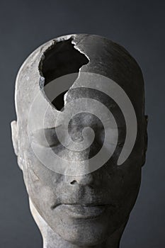 Mental Health Concept Showing Model Of Head With Fractured Piece In Skull photo