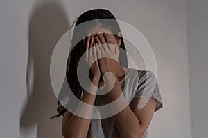 Mental health, depressed sad asian young woman, girl cover her face with hand, expression to face difficulty, failure and