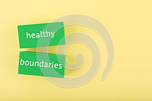 Mental health and healthy boundaries concept on yellow background with copy space