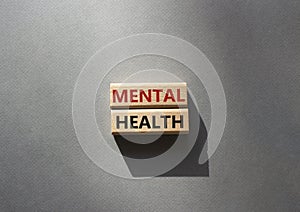 Mental health symbol. Wooden blocks with words Mental health. Beautiful grey background. Business and Mental health concept. Copy