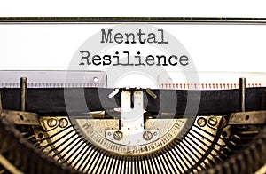 Mental resilience symbol. Concept word Mental resilience typed on retro old typewriter. Beautiful white background. Business
