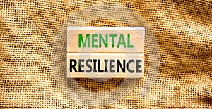 Mental resilience symbol. Concept word Mental resilience typed on wooden blocks. Beautiful canvas table canvas background.