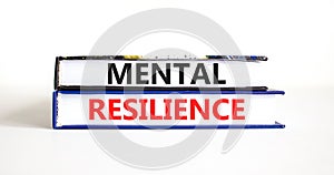 Mental resilience symbol. Concept word Mental resilience typed on books. Beautiful white table white background. Business