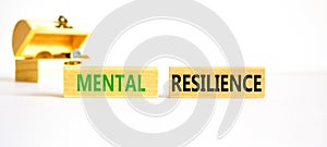 Mental resilience symbol. Concept word Mental resilience on wooden blocks. Beautiful white table white background. Wooden chest
