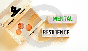 Mental resilience symbol. Concept word Mental resilience on wooden blocks. Beautiful white table white background. Wooden chest