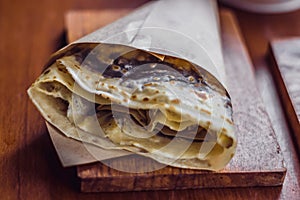 Mental warmth comfort calm silence. Breakfast cafe. Vintage matte photo. Large pancake on wooden board