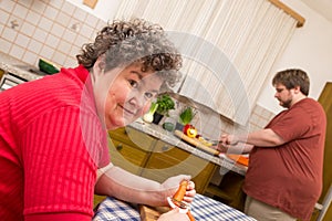 Mentally disabled woman in the kitchen