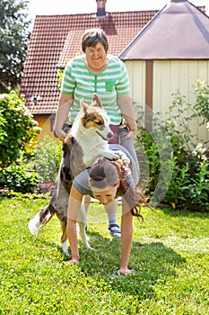 Mentally disabled woman with a second woman and a companion dog