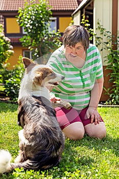 Mentally disabled woman with a second woman and a companion dog