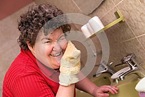 Mentally disabled woman with a washcloth