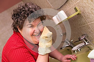Mentally disabled woman with a washcloth photo