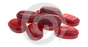 Menthol cherry flavor cough drops on a white background