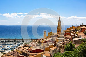 Menton, France. Aerial view of the old town architecture and the Basilica of Saint Michel Archange, the port and Riviera of Cote d