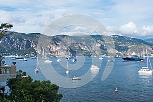 Menton, France. View of yachts, boats, mountains and sea on the Cote d`Azur on a sunny day. A luxury getaway on the French Rivier