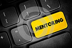 Mentoring is the influence, guidance, or direction given by a mentor, text button on keyboard, concept background