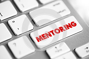 Mentoring is the influence, guidance, or direction given by a mentor, text concept button on keyboard