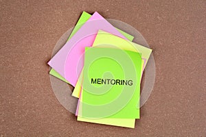 Mentoring word on colorful notes