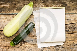 Menu background. Vegetables on table with cook book. Cooking with recipe book.
