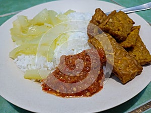 The menu for breakfast, consists of several side dishes, such as Tempe, sayur and sambal. Certainly healthy, to increase immunity photo