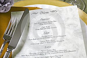 Menu and cutlery on restaurant table