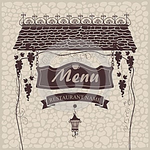 Menu with grapes on a stone wall
