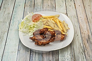 Menu plate fried chicken wings with salad and tomato