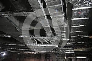 MEP works in civil construction site. Aluminum fabricated air flow duct and steel tray supporting works. ducting work. duct Insula