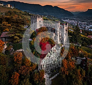 Merano, Italy - Aerial panoramic view of the famous Castle Brunnenburg with the city of Merano, the Italian Dolomites