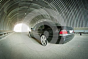 Mercedes goes on light in a tunnel photo