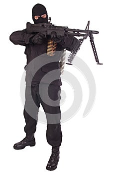 Mercenary in black uniforms with machine gun