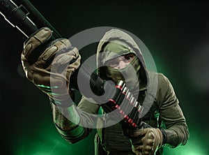 Mercenary soldier with a shotgun photo
