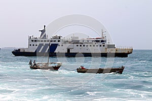 Merchandise boat leaving the Dar el Salaam city bay, Tanzania, Africa