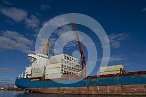 Merchant ship moored in the Port of San Antonio Este, photo