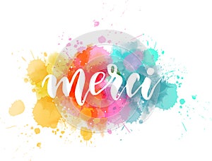 Merci lettering on watercolor paint splash