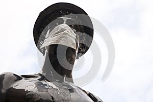 The Mercurial statue in Glasgow street has been turned into a symbol of the coronavirus covid 19 by wearing a protective mask.