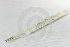 Mercury thermometer with celsius degrees, isolated. Medical thermometer on white background. Normal human temperature.