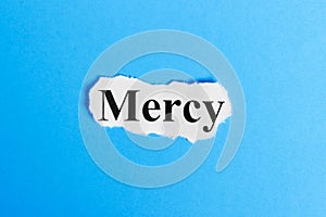 mercy text on paper. Word mercy on a piece of paper. Concept Image photo