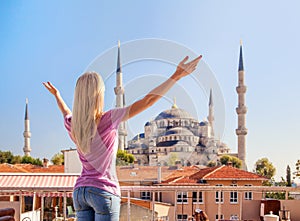 Merhaba, Istanbul! Girl welcomes the Blue mosque in Istanbul.