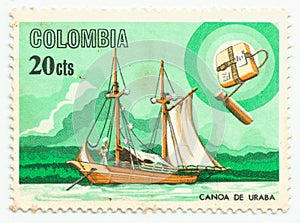 MERIDA, EXTREMADURA, SPAIN - DIC, 1, 2.018 -  A stamp printed in Colombia shows uraba canoe. CIRCA: 1.975