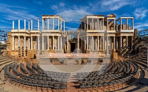 Merida Roman theater from behind with a view of the chairs, granite steps and the stage scaenae frons of classical Roman columns